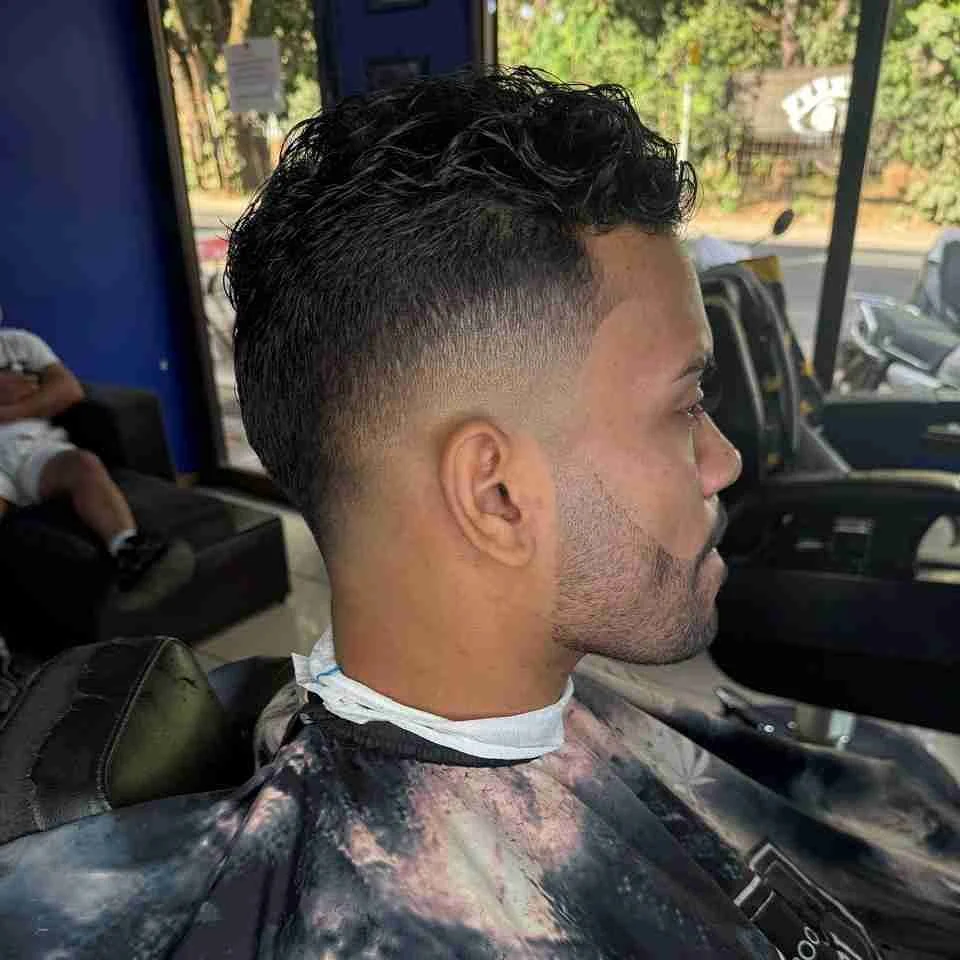 Curls with a fade and sharp line-up