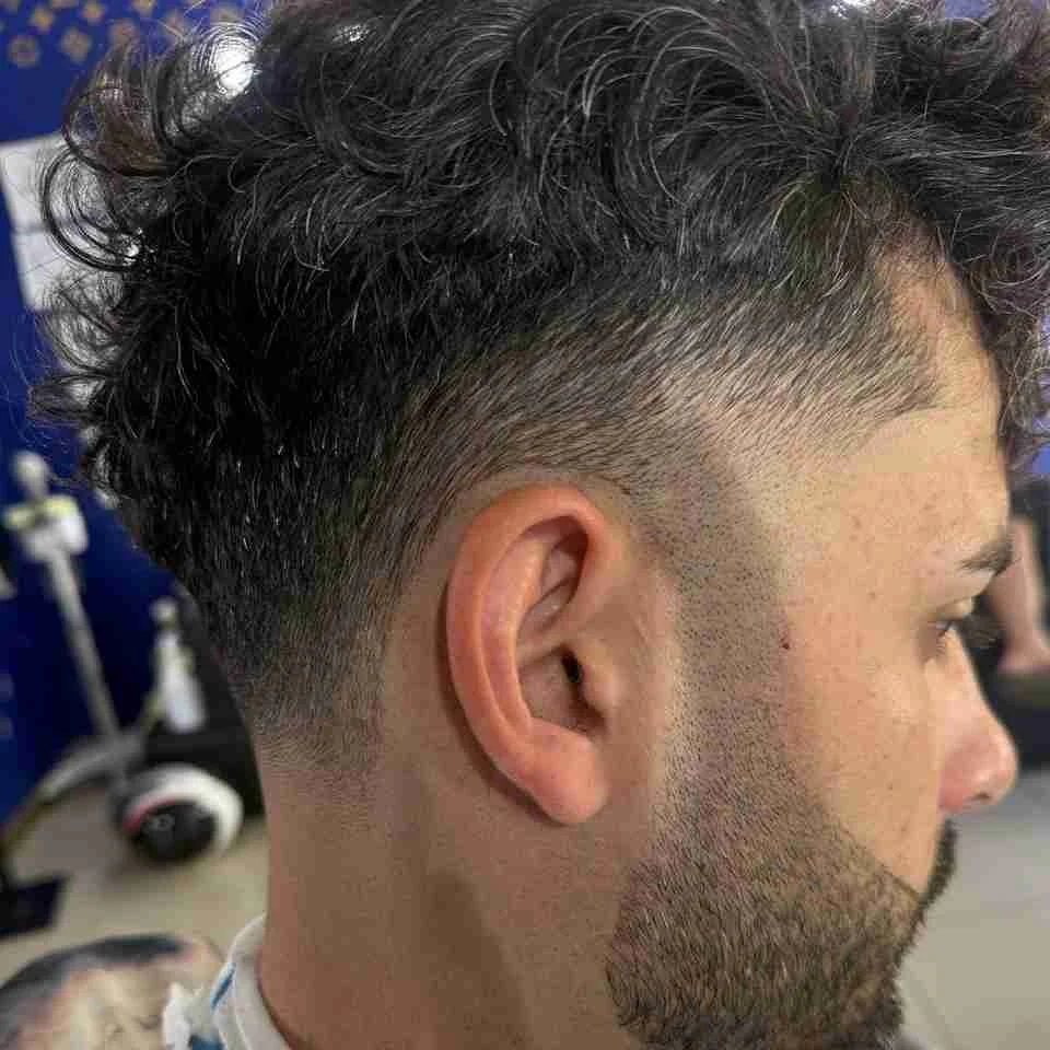 Curly hair with a side fade